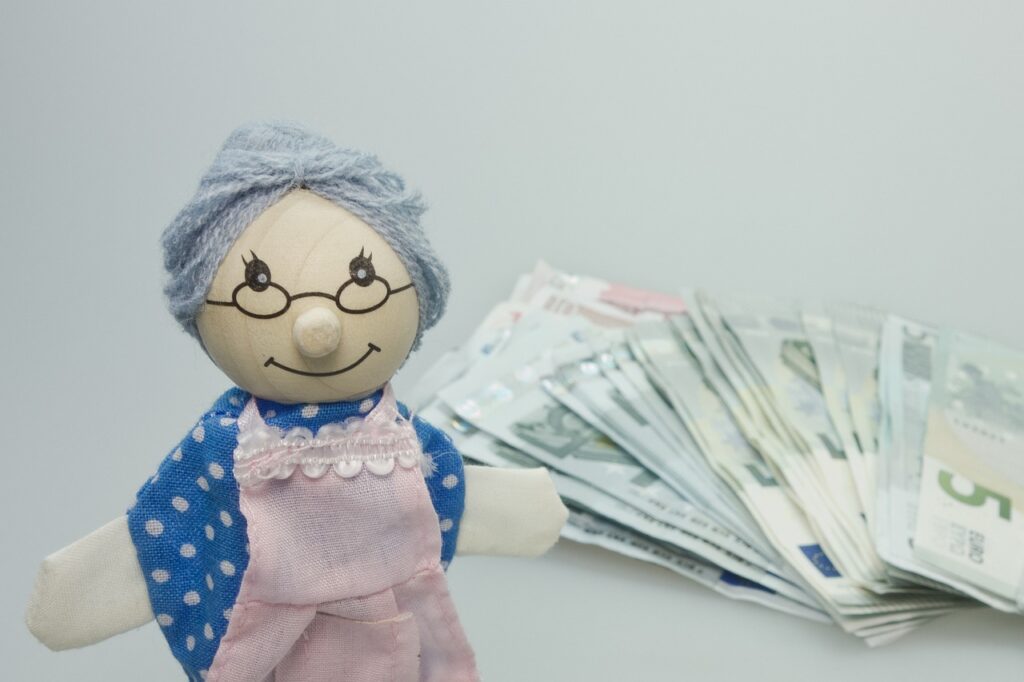 puppet, granny, children's toys, wood, to play, nostalgia, nostalgic, money, banknotes, euro, save up, savings book, pension, apron, pension cut, pension increase, pocket money, pension, pension, pension, pension, pension