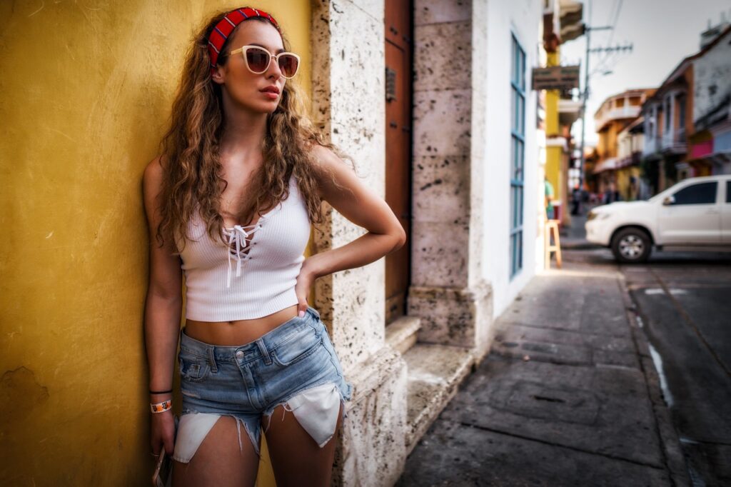 city, street, girl, colombia, sunglasses, yellow, urban, people, road, building, traffic, buildings, busy, architecture, fashion, infrastructure, downtown, outdoors, travel, tourist