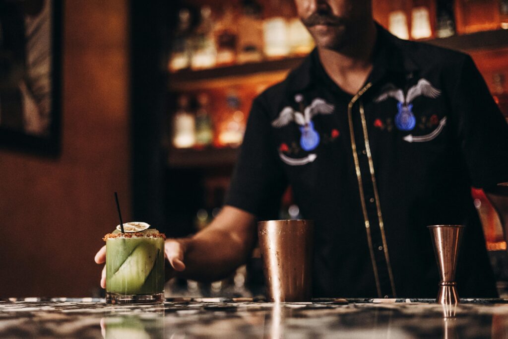 A skilled bartender preparing a unique cocktail at a stylish bar in Fort Lauderdale.