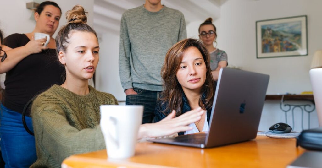 A diverse group of adults collaborating in a cozy indoor office space.