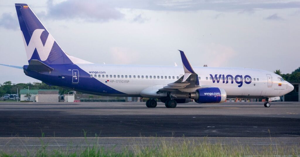 Wingo Airlines Boeing 737 parked on an airport tarmac during the day.