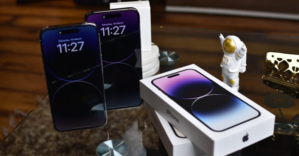 Close-up of Apple iPhone 14 Pro Max with astronaut figurine on a reflective surface.