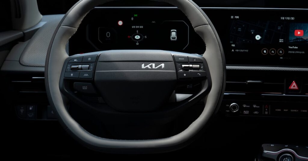 Close-up view of the Kia EV's steering wheel showcasing its modern design and technology.