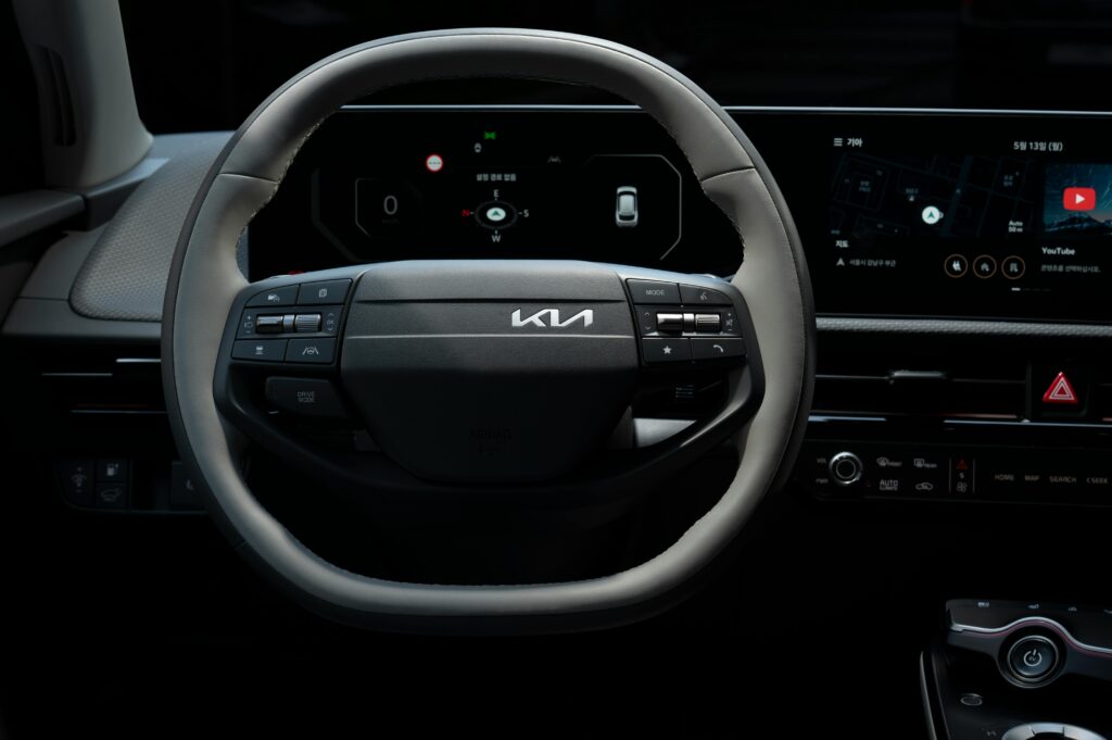 Close-up view of the Kia EV's steering wheel showcasing its modern design and technology.