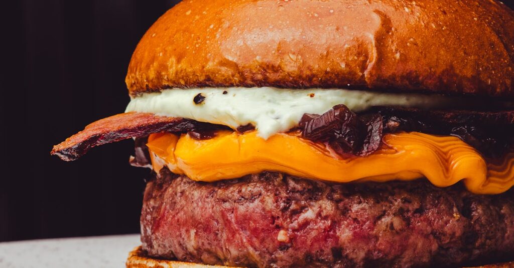 Delicious gourmet cheeseburger featuring juicy beef patty, cheddar cheese, and crispy bacon.