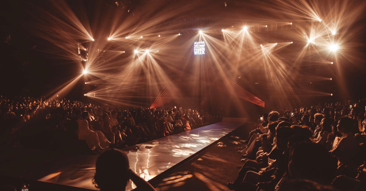 Exciting fashion show event with dazzling lights and a captivated audience.